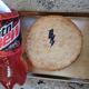 Code Red bottle beside finished pie